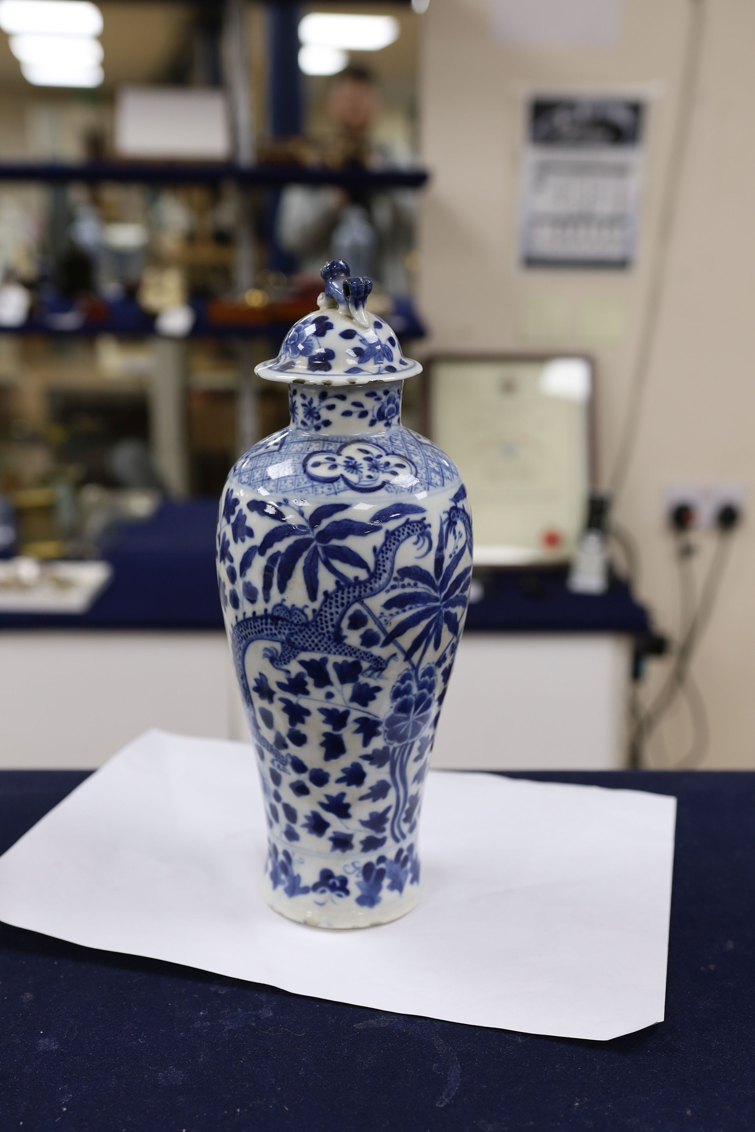 A pair of Chinese blue and white dragon vases and covers, circa 1900. 28cm